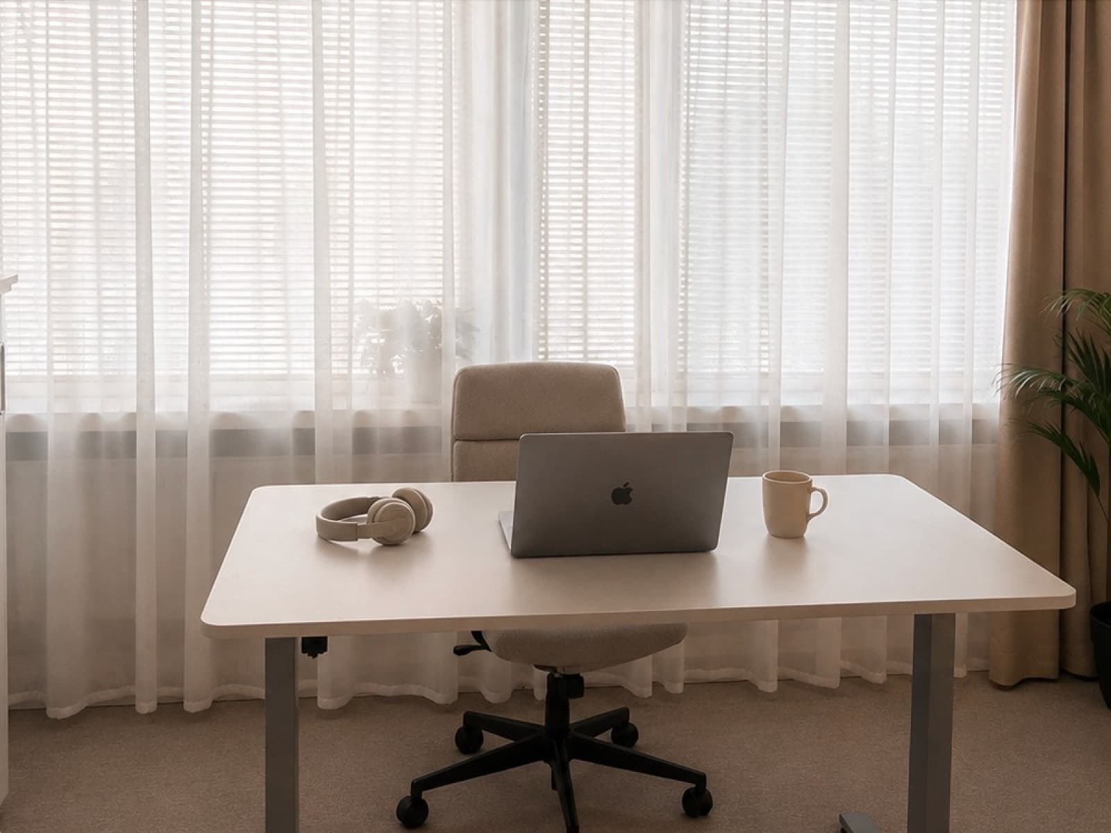 Woman joining an online therapy session with WellSight from her laptop